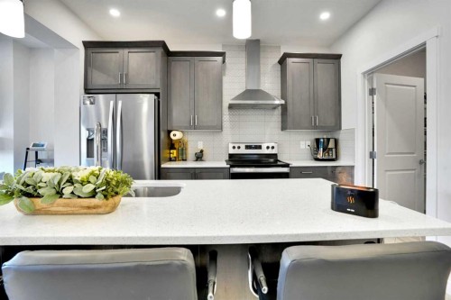 1457 Bayview Point Sw, Airdrie, AB - Indoor Photo Showing Kitchen With Stainless Steel Kitchen With Upgraded Kitchen