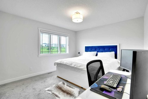 1457 Bayview Point Sw, Airdrie, AB - Indoor Photo Showing Bedroom