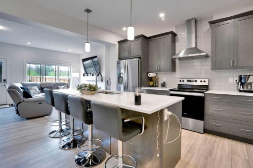 1457 Bayview Point Sw, Airdrie, AB - Indoor Photo Showing Kitchen With Stainless Steel Kitchen With Upgraded Kitchen