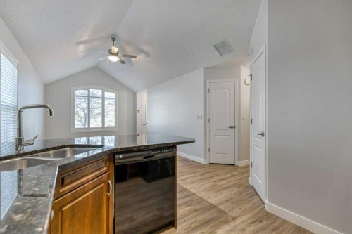 13-24 River Heights View, Cochrane, AB - Indoor Photo Showing Kitchen With Double Sink