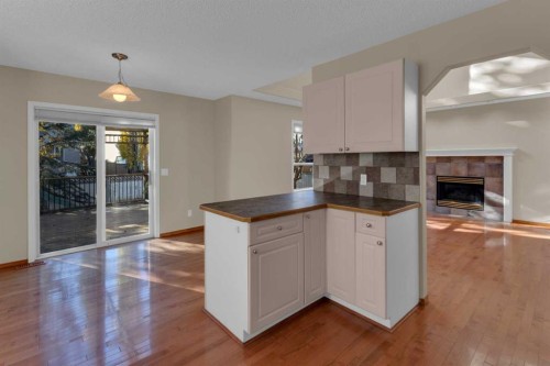 202 Citadel Circle Nw, Calgary, AB - Indoor Photo Showing Kitchen With Fireplace
