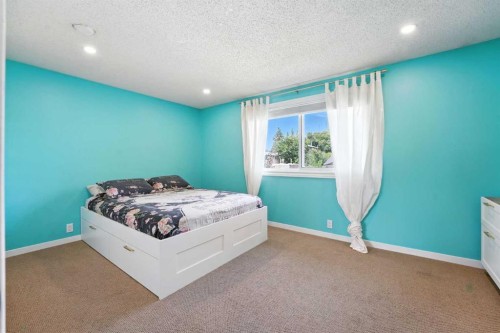 123 Silverstone Road Nw, Calgary, AB - Indoor Photo Showing Bedroom