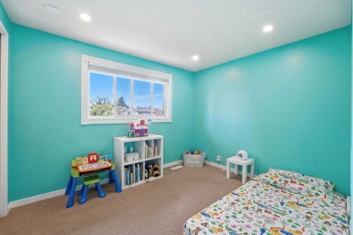 123 Silverstone Road Nw, Calgary, AB - Indoor Photo Showing Bedroom