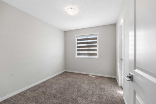 281 Creekside Boulevard Sw, Calgary, AB - Indoor Photo Showing Other Room