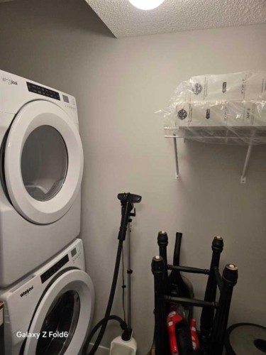 281 Creekside Boulevard Sw, Calgary, AB - Indoor Photo Showing Laundry Room