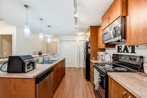 2212-700 Willowbrook Road Nw, Airdrie, AB - Indoor Photo Showing Kitchen With Double Sink