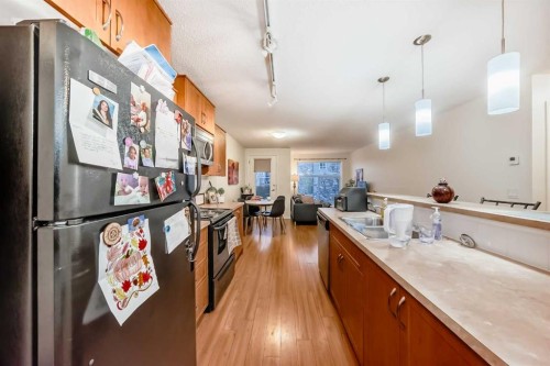 2212-700 Willowbrook Road Nw, Airdrie, AB - Indoor Photo Showing Kitchen With Double Sink
