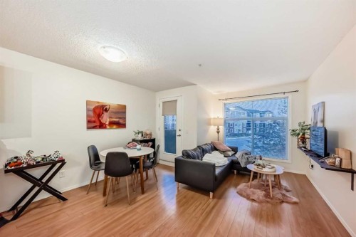 2212-700 Willowbrook Road Nw, Airdrie, AB - Indoor Photo Showing Living Room