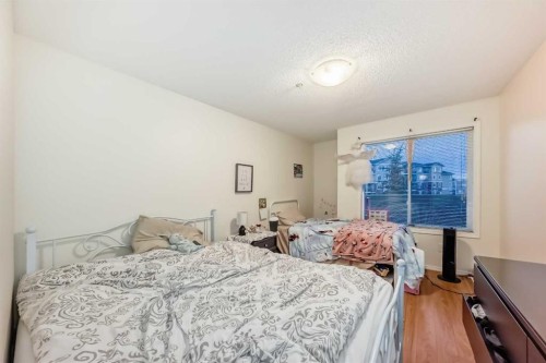 2212-700 Willowbrook Road Nw, Airdrie, AB - Indoor Photo Showing Bedroom