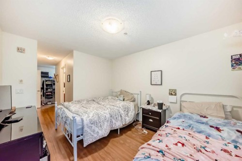 2212-700 Willowbrook Road Nw, Airdrie, AB - Indoor Photo Showing Bedroom
