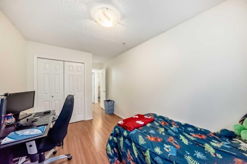 2212-700 Willowbrook Road Nw, Airdrie, AB - Indoor Photo Showing Bedroom