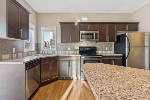 34 Kingsland Close, Airdrie, AB - Indoor Photo Showing Kitchen With Double Sink
