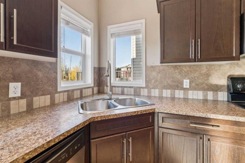 34 Kingsland Close, Airdrie, AB - Indoor Photo Showing Kitchen With Double Sink
