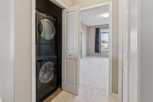 34 Kingsland Close, Airdrie, AB - Indoor Photo Showing Laundry Room