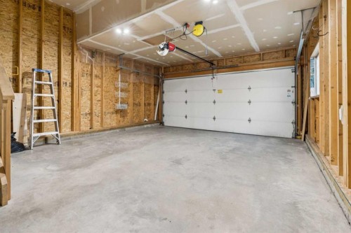 34 Kingsland Close, Airdrie, AB - Indoor Photo Showing Garage