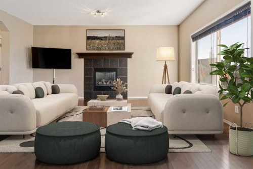34 Kingsland Close, Airdrie, AB - Indoor Photo Showing Living Room With Fireplace