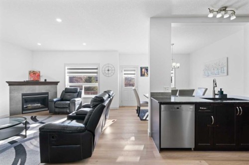 105 Everhollow Rise Sw, Calgary, AB - Indoor Photo Showing Other Room With Fireplace