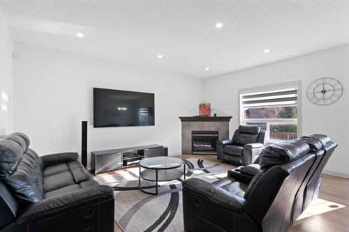 105 Everhollow Rise Sw, Calgary, AB - Indoor Photo Showing Living Room With Fireplace