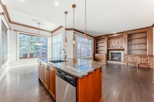 157 Everoak Park Sw, Calgary, AB - Indoor Photo Showing Kitchen With Fireplace