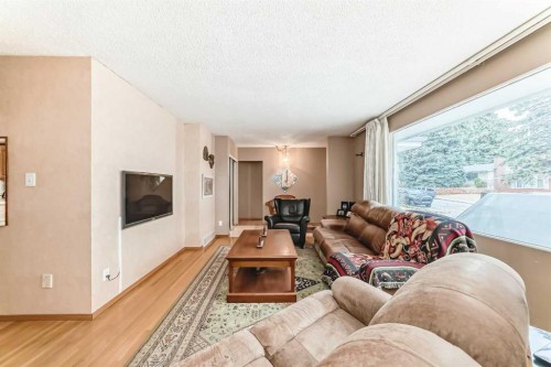 627 Seymour Avenue Sw, Calgary, AB - Indoor Photo Showing Living Room With Fireplace