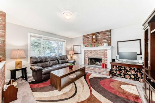 363 Templeside Circle Ne, Calgary, AB - Indoor Photo Showing Living Room With Fireplace