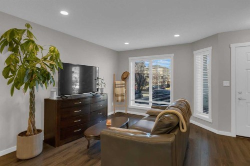 108-2400 Ravenswood View Se, Airdrie, AB - Indoor Photo Showing Living Room