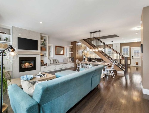 96 Beny-Sur-Mer Road Sw, Calgary, AB - Indoor Photo Showing Living Room With Fireplace