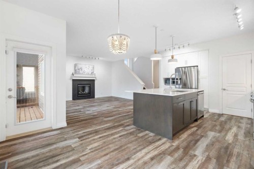 248 Ranch Close, Strathmore, AB - Indoor Photo Showing Kitchen With Fireplace
