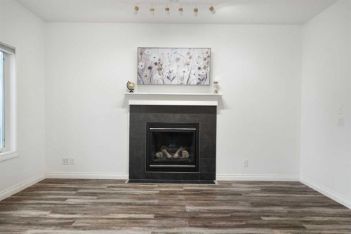 248 Ranch Close, Strathmore, AB - Indoor Photo Showing Living Room With Fireplace