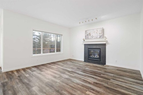 248 Ranch Close, Strathmore, AB - Indoor Photo Showing Living Room With Fireplace