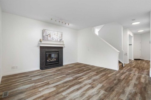 248 Ranch Close, Strathmore, AB - Indoor Photo Showing Living Room With Fireplace