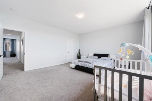 633 Windrow Manor Sw, Airdrie, AB - Indoor Photo Showing Bedroom