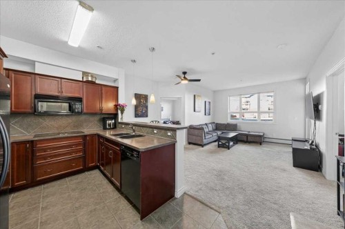 253-26 Val Gardena View Sw, Calgary, AB - Indoor Photo Showing Kitchen With Double Sink