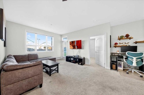 253-26 Val Gardena View Sw, Calgary, AB - Indoor Photo Showing Living Room