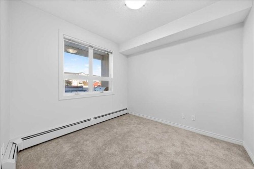 253-26 Val Gardena View Sw, Calgary, AB - Indoor Photo Showing Other Room