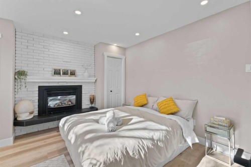 3832 40 Avenue Nw, Calgary, AB - Indoor Photo Showing Bedroom With Fireplace