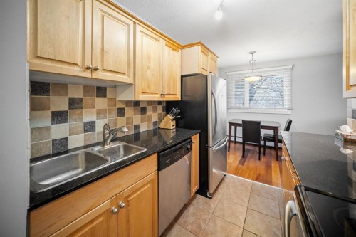 203-1719 11 Avenue Sw, Calgary, AB - Indoor Photo Showing Kitchen With Double Sink