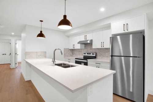 2514 16A Street Se, Calgary, AB - Indoor Photo Showing Kitchen With Stainless Steel Kitchen With Double Sink With Upgraded Kitchen