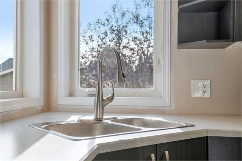 141 Tuscany Valley Green, Calgary, AB - Indoor Photo Showing Kitchen With Double Sink