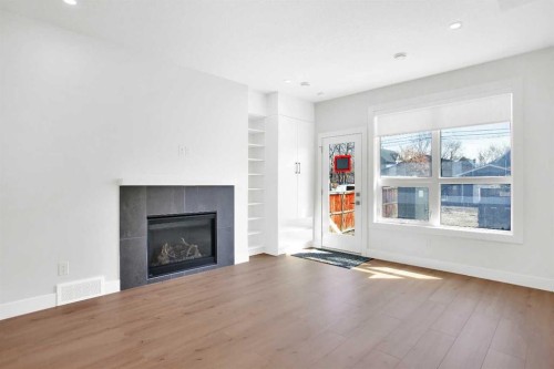 2516 16A Street Se, Calgary, AB - Indoor Photo Showing Living Room With Fireplace