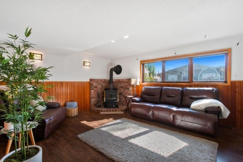 5445 56 Street, Olds, AB - Indoor Photo Showing Living Room With Fireplace