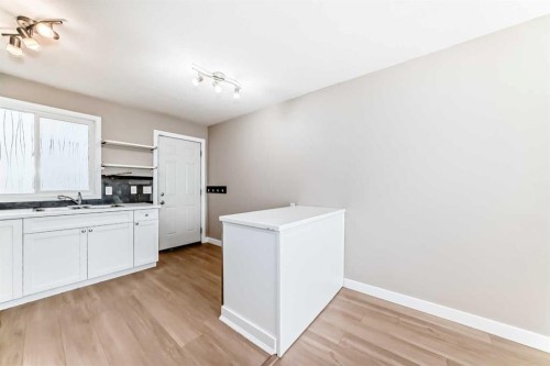 1106 53A Street Se, Calgary, AB - Indoor Photo Showing Kitchen With Double Sink
