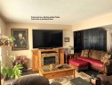 3828 Eastwood Crescent, Red Deer, AB  - Indoor Photo Showing Living Room With Fireplace 