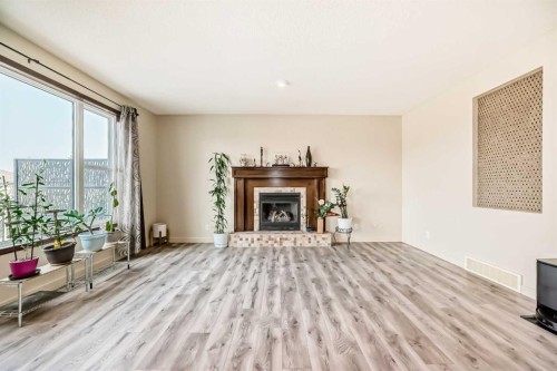 367 Hidden Creek Boulevard Nw, Calgary, AB - Indoor Photo Showing Living Room With Fireplace