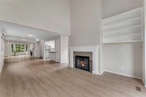 37 Edgeford Way Nw, Calgary, AB - Indoor Photo Showing Living Room With Fireplace