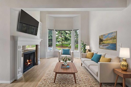 37 Edgeford Way Nw, Calgary, AB - Indoor Photo Showing Living Room With Fireplace