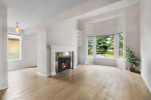 37 Edgeford Way Nw, Calgary, AB - Indoor Photo Showing Living Room With Fireplace