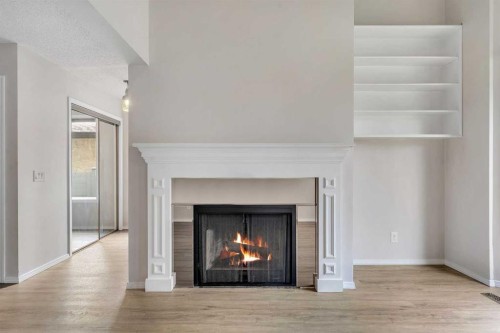 37 Edgeford Way Nw, Calgary, AB - Indoor Photo Showing Living Room With Fireplace