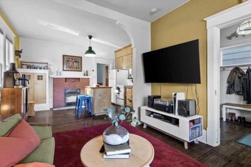 1038 1 Avenue Nw, Calgary, AB - Indoor Photo Showing Living Room With Fireplace