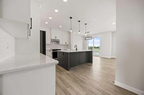 494 Kinniburgh Loop, Chestermere, AB - Indoor Photo Showing Kitchen With Upgraded Kitchen